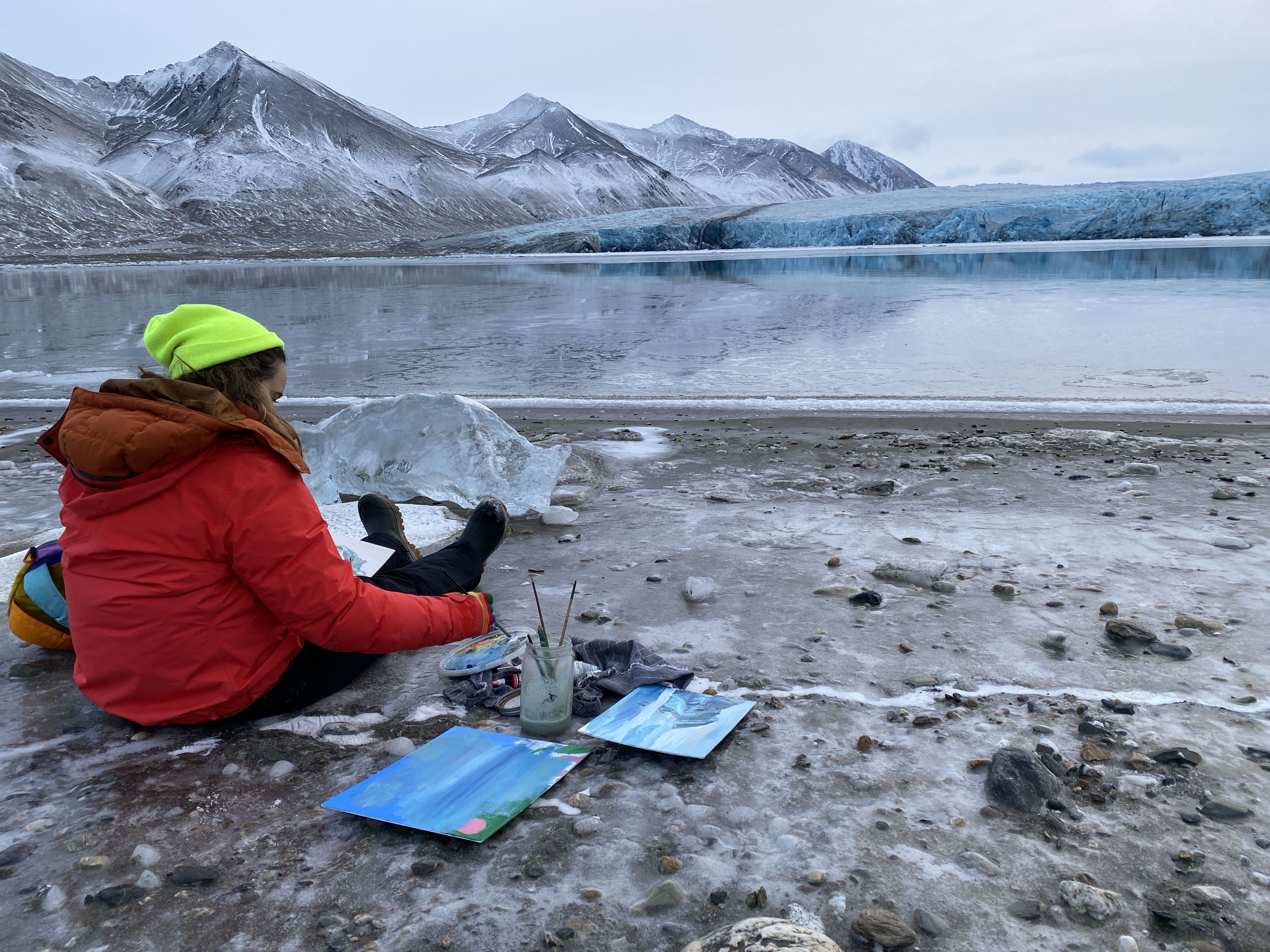 Jenn painting near a glacier