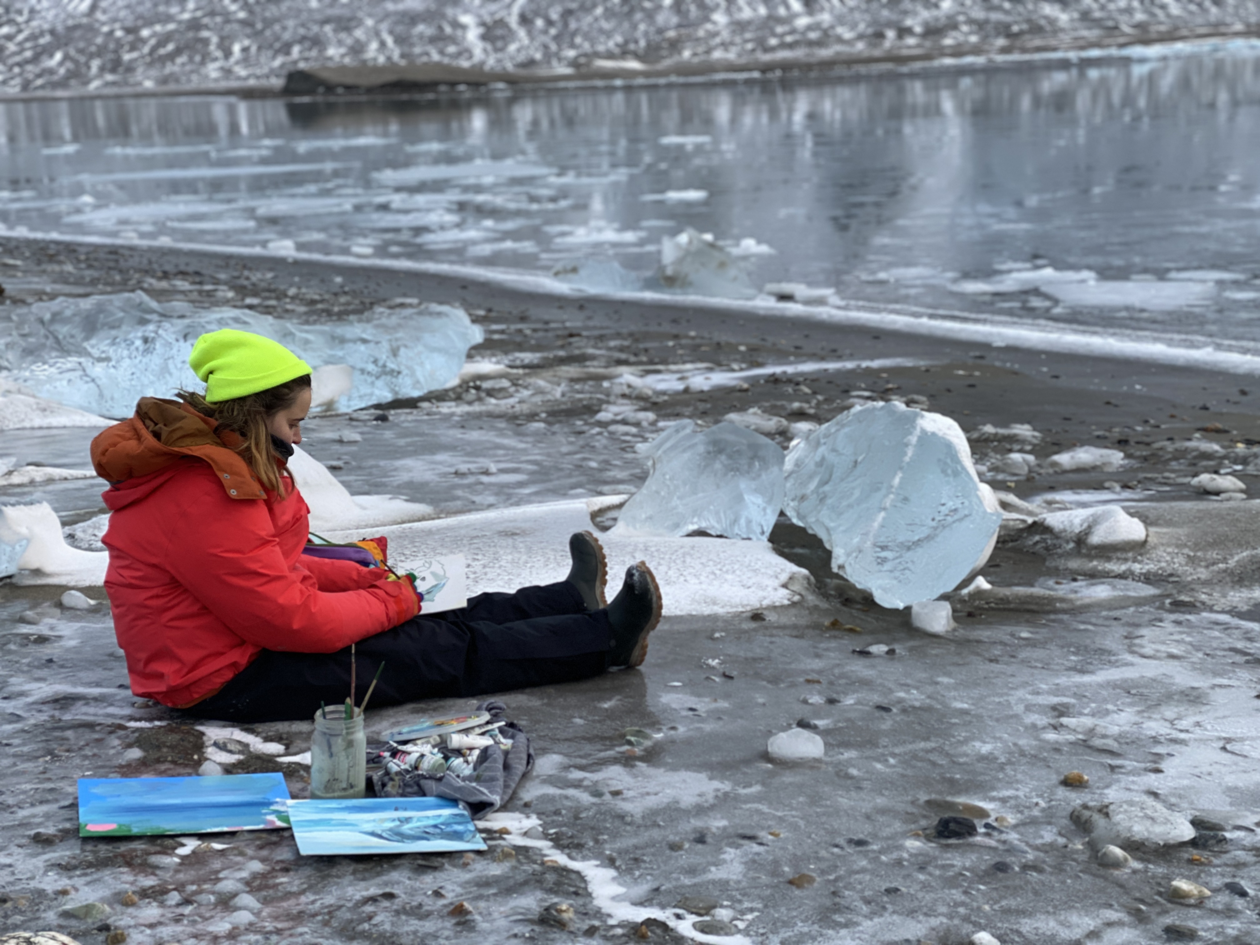 Jenn painting near a glacier