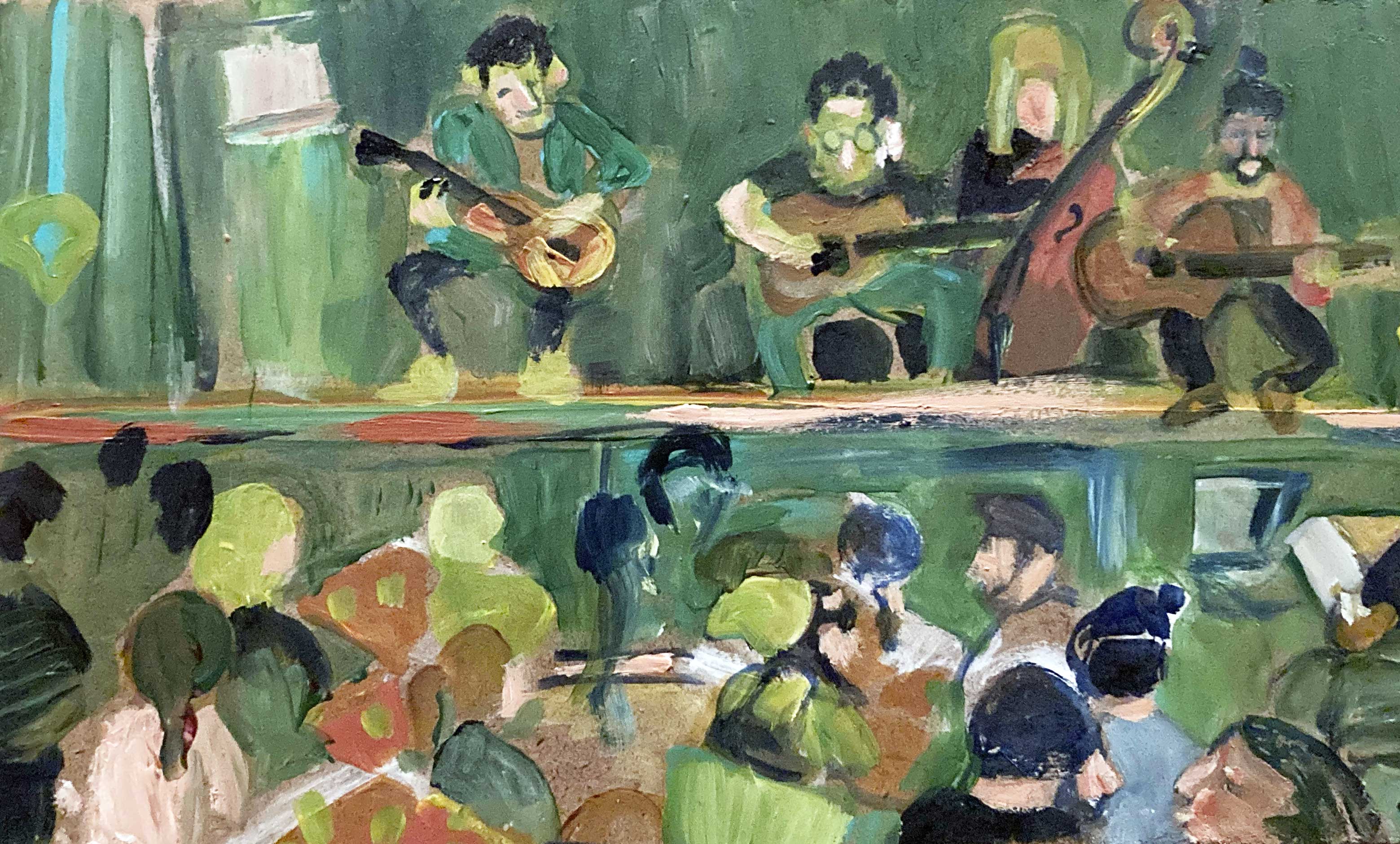 Musicians playing on stage to a crowded room