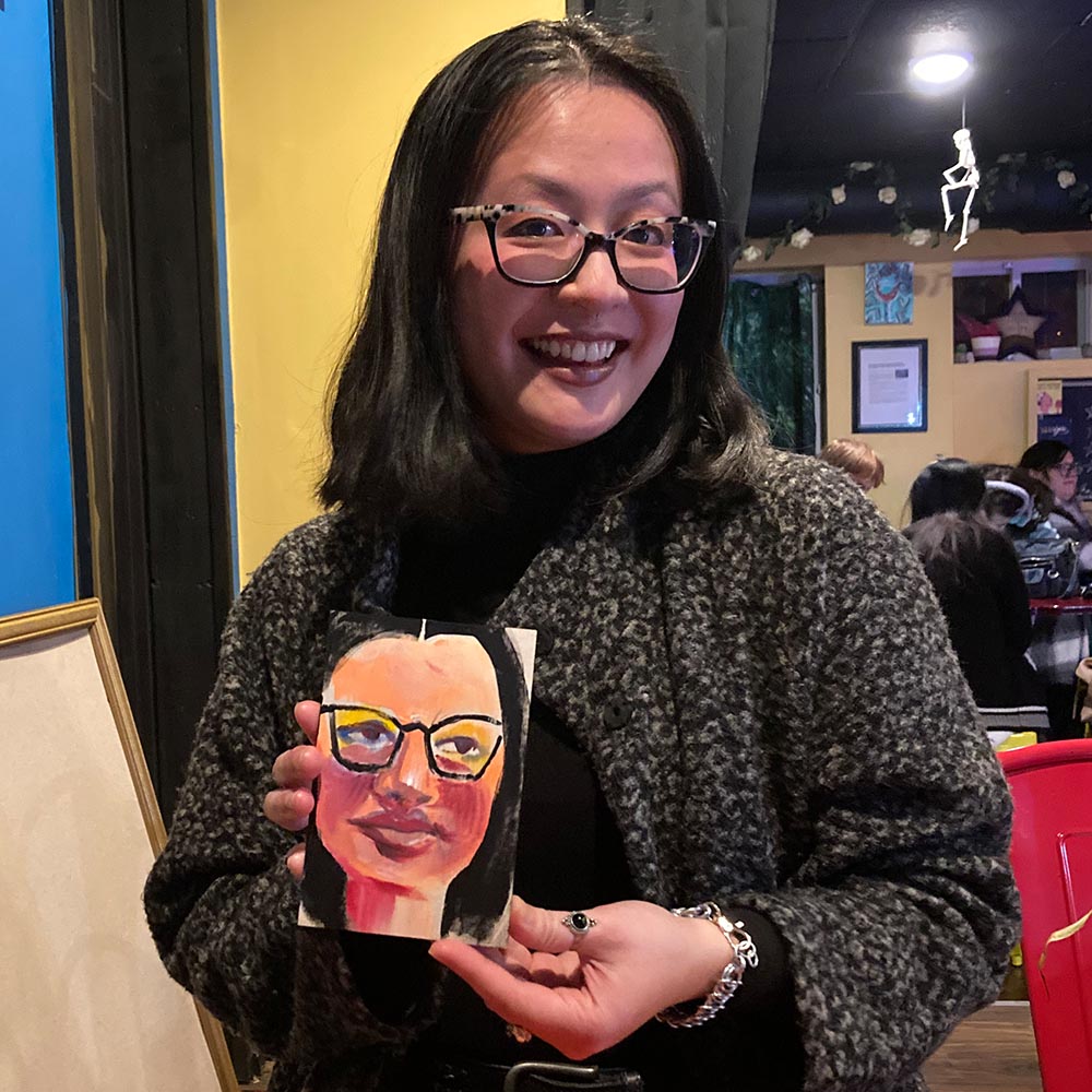 Photo of people smiling with their portrait