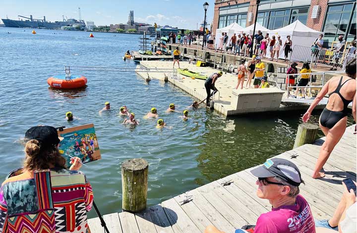 Jenn painting swimmers racing in Baltimore Inner Harbor
