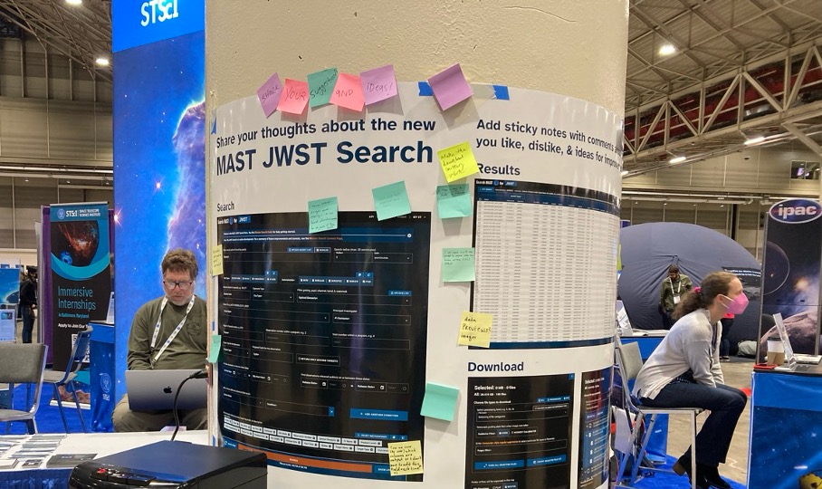 Photo of poster of MAST search at a conference with sticky notes on it